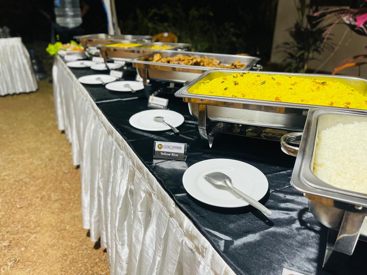 Outdoor evening buffet with yellow rice